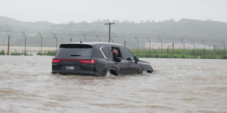 Kim Jong-un surveys massive flooding in North Korea from his Lexus as 5,000 rescued