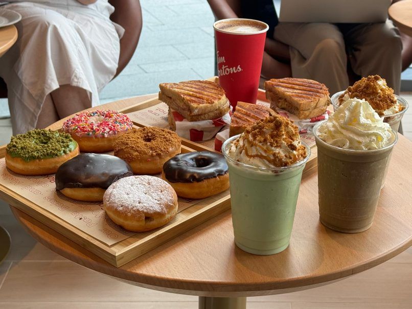 a photo of a selection of food items served at tim hortons malaysia, including sandwiches and donuts