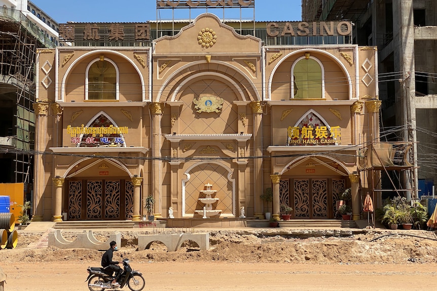 An exterior shot of a closed Cambodian casino. 