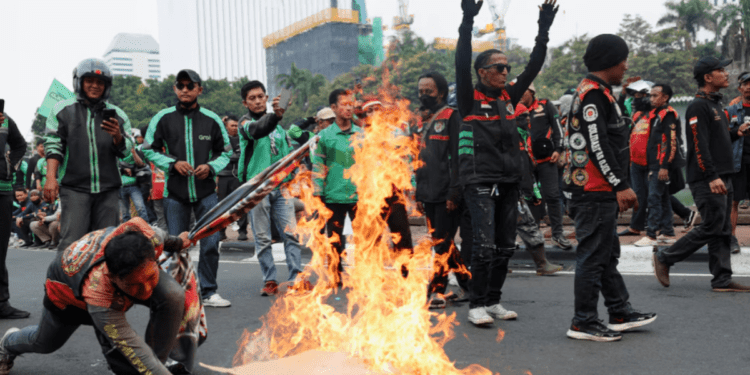 Indonesian app-based taxi drivers strike in protest over low pay, Asia News