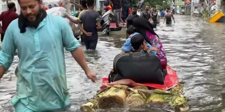 Rescuers struggle to reach people stranded by deadly floodwaters in eastern Bangladesh