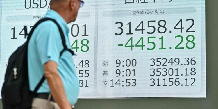 Stock market rout worsens in Asia: Singapore share index sinks 4.1%, Japan dives 12%