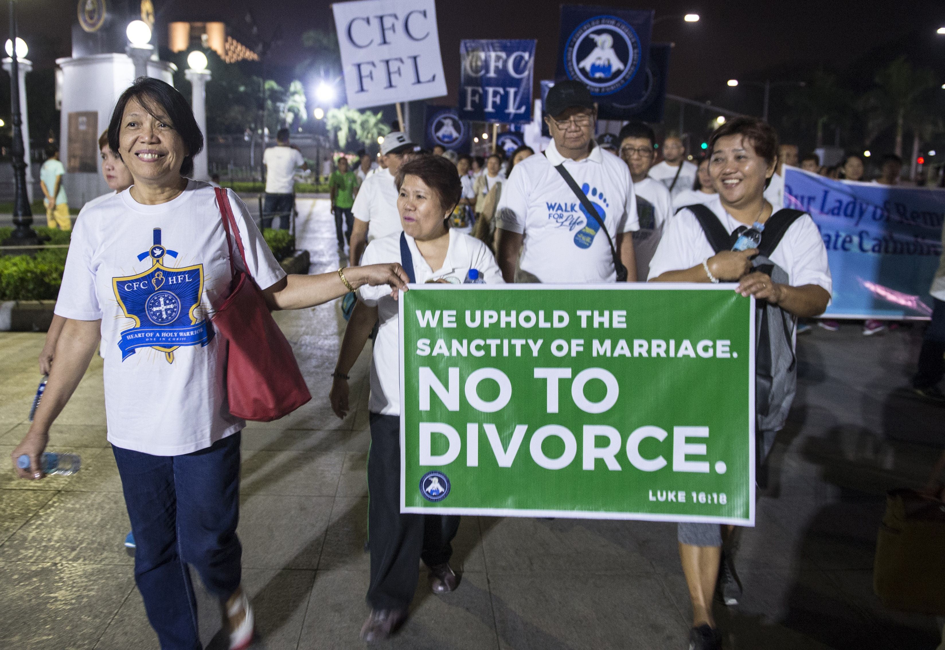 File. Philippine Catholic faithful holding a banner as they take part in a ‘Walk for Life’ protest at a park in Manila