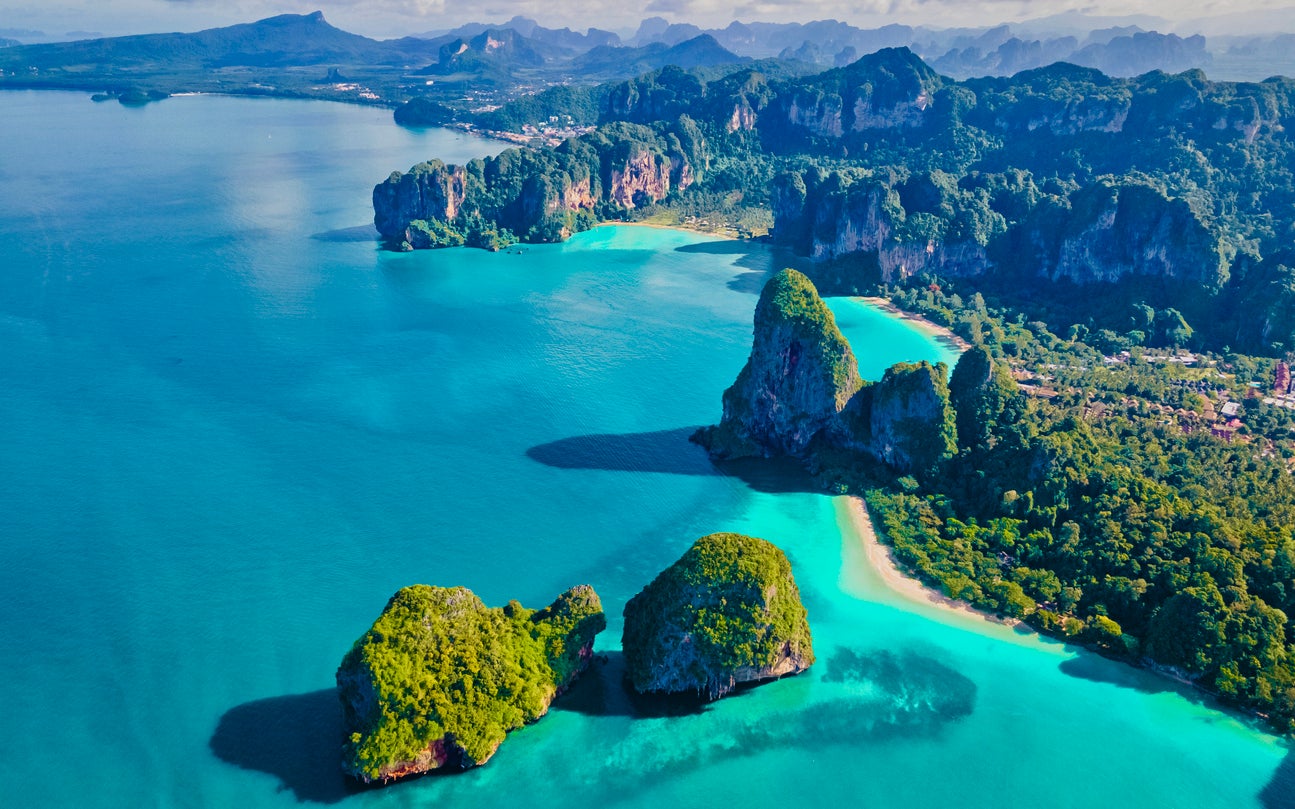 Railay Bay is surrounded by picturesque limestone rocks and crystal clear waters