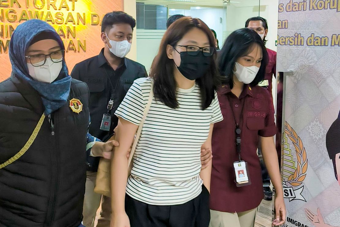 Guo was escorted by Indonesian immigration officers prior to her deportation.