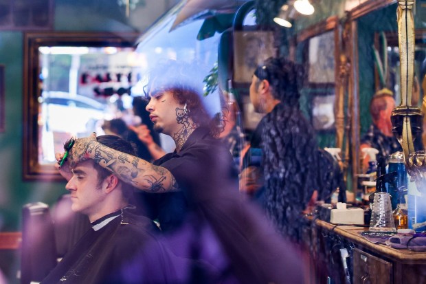 Customer Desmond Griffith gets a short gentleman's cut by barber Mateo G. at Slick and Dapper Barbershop in Oakland, Calif., on Thursday, Sept. 5, 2024. (Ray Chavez/Bay Area News Group)