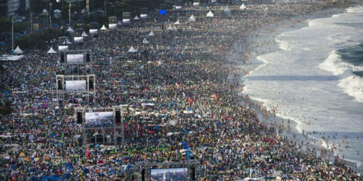 How does the huge crowd for the pope's Mass in East Timor compare to others?