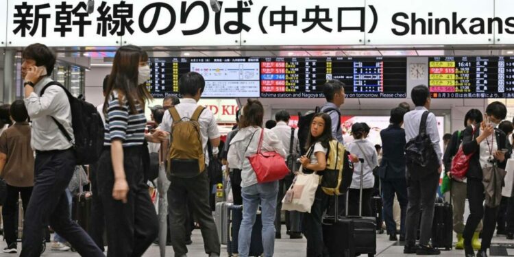 Japanese typhoon weakens but train and flight disruptions continue