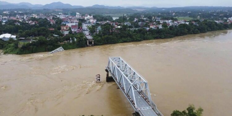 Vietnam storm deaths rise to 64 as a bridge collapses and flooding sweeps away a bus